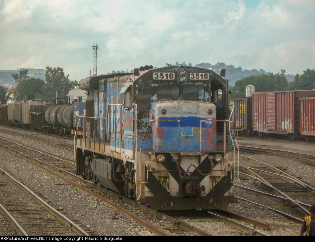 FXE C30-7 Locomotive in the yard with faded paint scheme